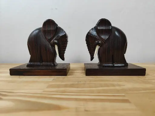 Paire de serre livre éléphant signé 